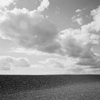 A shingle beach and sky